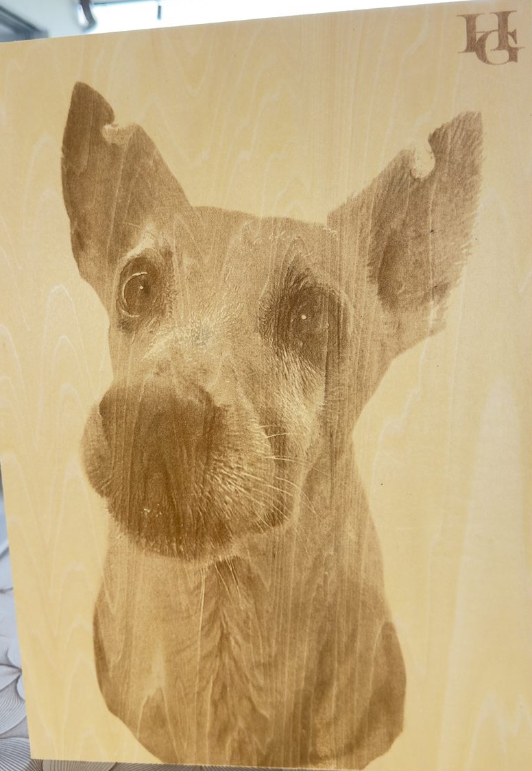 Photo-style dog portrait engraving on wood