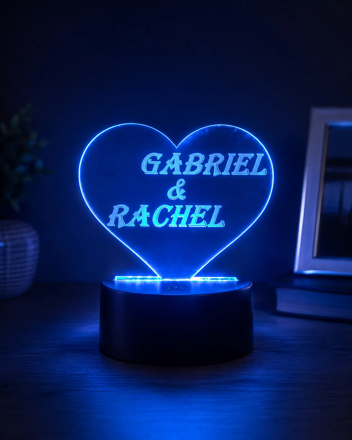 Heart-shaped personalised acrylic LED lamp illuminated in blue