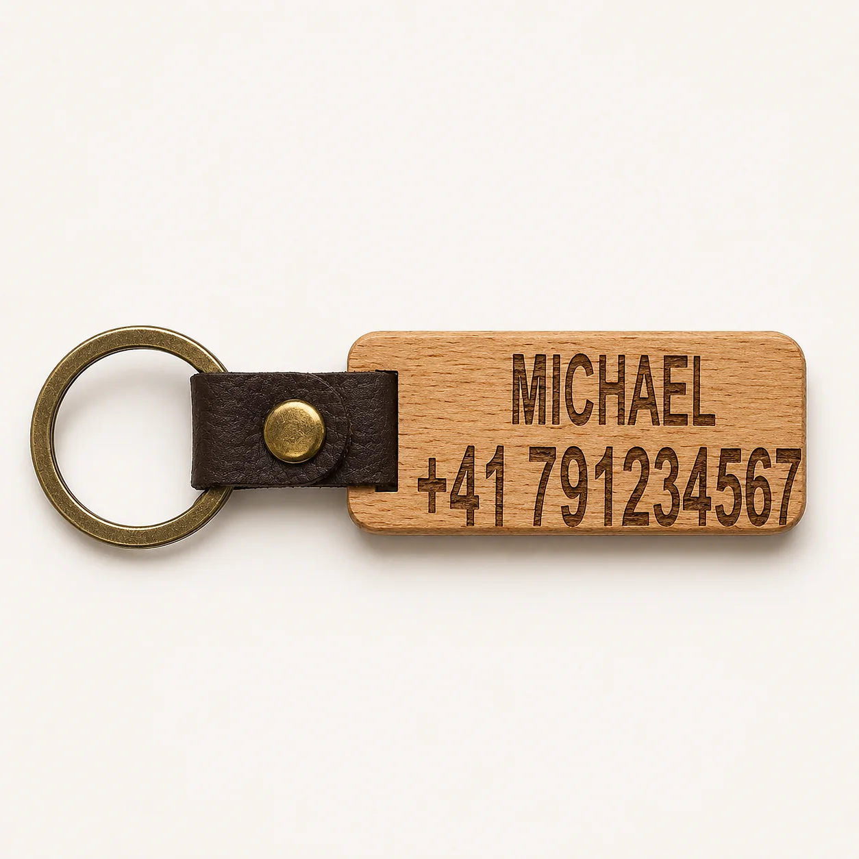 Light wooden keyring engraved with a name and telephone number