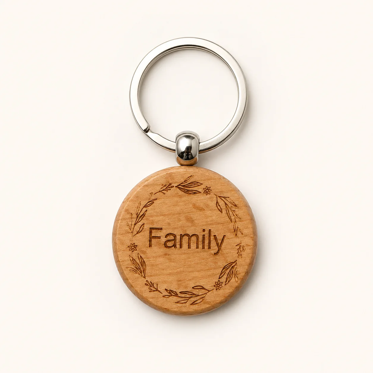Round wooden keyring engraved with Family and a floral wreath