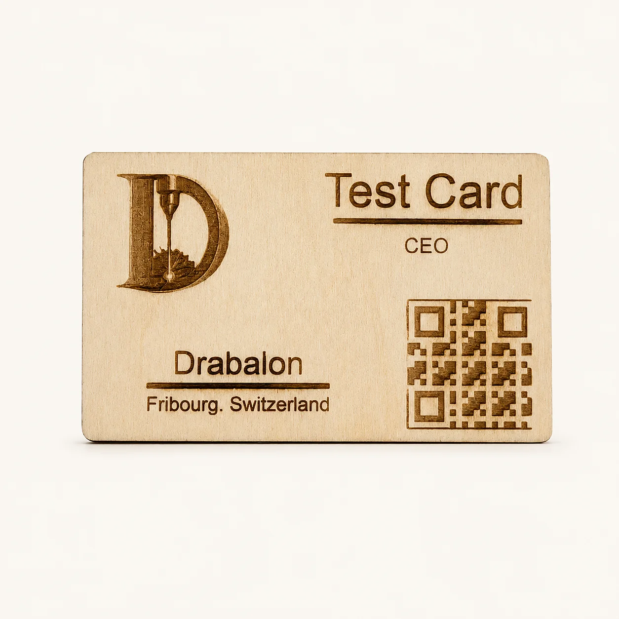 Wooden business card engraved with a logo, contact details and QR code